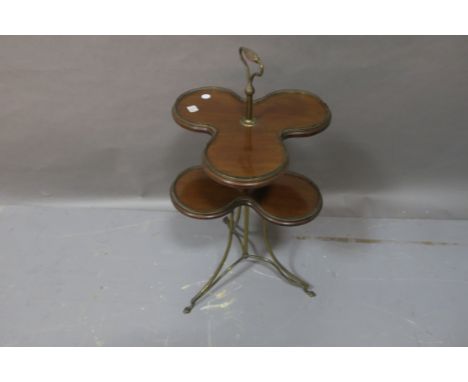 A LATE 19TH CENTURY MAHOGANY AND GILT BRASS MOUNTED TWO TIER OCCASIONAL TABLE, the tri-rounded tops headed by pierced brass g