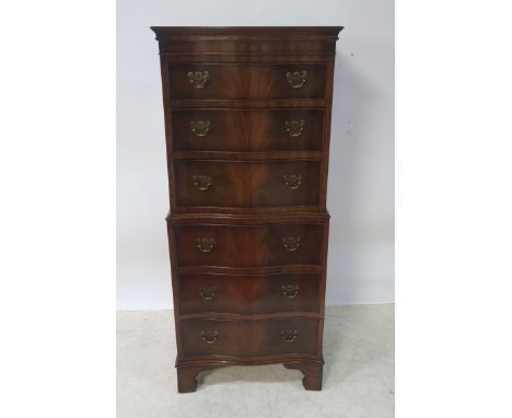 A FINE GEORGIAN STYLE MAHOGANY SERPENTINE TALLBOY, six graduated drawers with brass drop handles on bracket feet 130cms high 