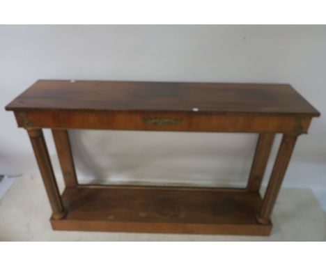 A 19TH CENTURY REGENCY STYLE CONSOLE TABLE, the rectangular top above a slightly inset frieze with gilt brass foliate mounts 