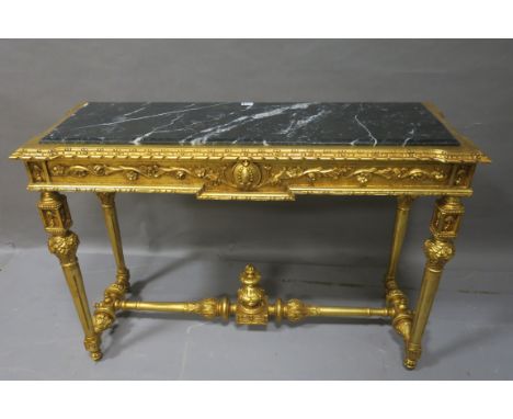 A CONTINENTAL GILT FRAMED CONSOLE TABLE, of rectangular form with black marble inserts above a foliate frieze raised on turne