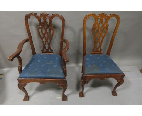 A SET OF 10 CHIPPENDALE STYLE MAHOGANY DINING ROOM CHAIRS, (including 2 carvers) the rectangular open backs with scrolled top