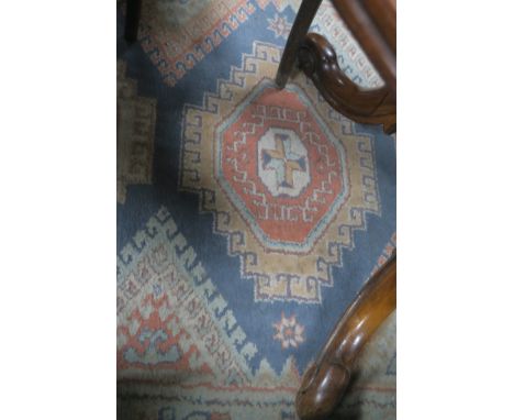 A WOOL RUG, the light grey ground with geometric panels within a conforming border,170cms x 230cms.