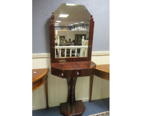 AN ART DECO STYLE ROSEWOOD VENEERED CONSOLE TABLE AND MIRROR, the rectangular plate with canted corners between stepped sides