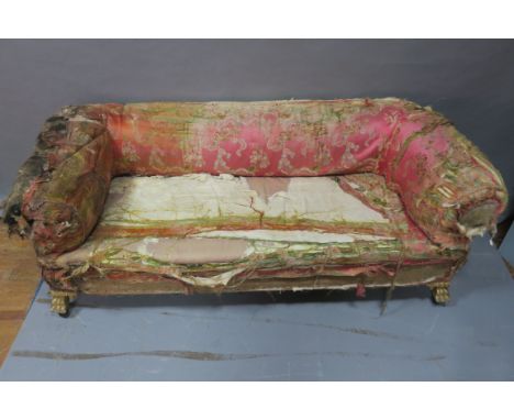 A 19TH CENTURY SOFA, of rectangular form the rounded back and scrolled arms above the rectangular seat raised on carved paw f