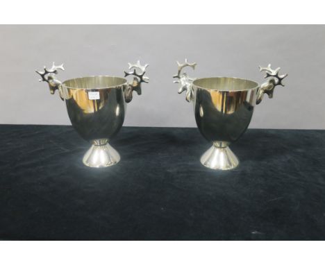 A PAIR OF CHROME HUNTING CUPS,  of circular tapering form the handles modelled as stags heads with horns on splayed circular 