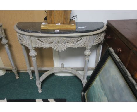 A PAIR OF CONTINENTAL GREY PAINTED AND MARBLE TOP CONSOLE TABLES, each of demi-lune outline with carved frieze on cylindrical