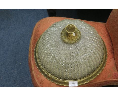 A CONTINENTAL GILT BRASS AND CUT GLASS CEILING LIGHT, decorated with facetted pendants, and pineapple finial.