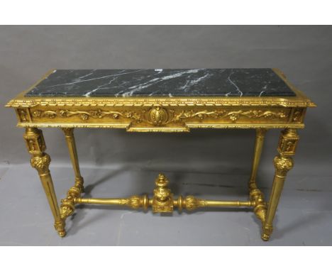 A CONTINENTAL GILT FRAMED CONSOLE TABLE, of rectangular form with black marble inserts above a foliate frieze raised on turne