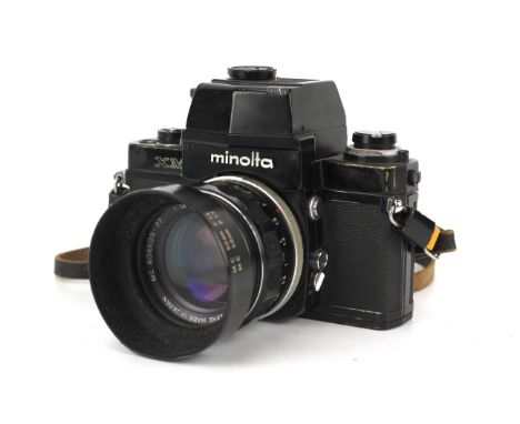 A Minolta XM 35mm SLR camera. Black, serial number 2116595. With a Minolta 58mm f1.4 Rokkor-PF lens, AE prism viewfinder. len