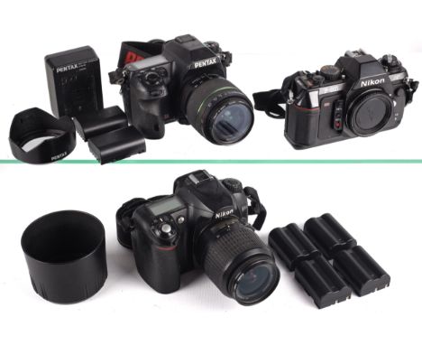 An assortment of cameras to include Pentax K-7 with a Pentax 18-55mm lens, A Nikon F-501, Nikon D50 digital camera and other 