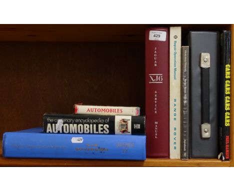 Various car and automobile reference books, including Jaguar XJ6 Service Manual 