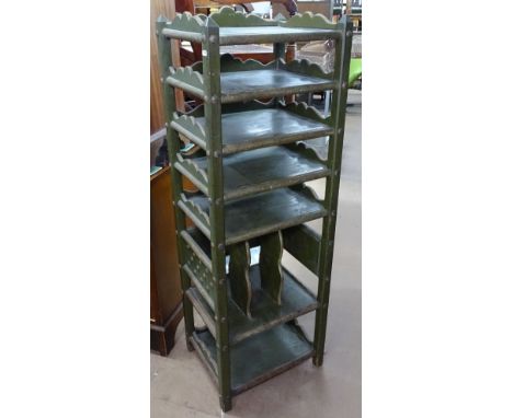 A Vintage green painted 7-tier open stand, with studwork decoration, W45cm, H135cm 