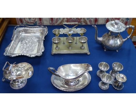 A collection of silver plated items, to include teapot, embossed swing-handled tray, egg cup set etc 