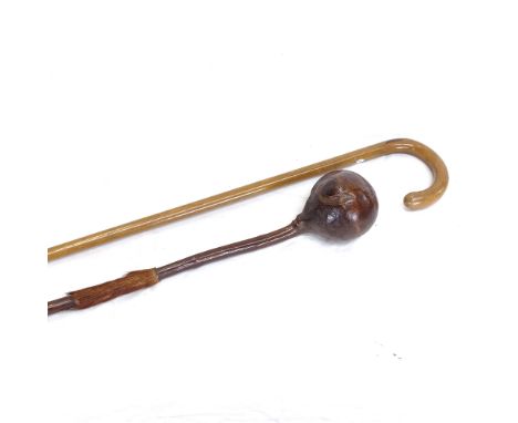 A Zulu hardwood knobkerry with animal fur fringe, and a walking stick, knobkerry length 65cm (2) 