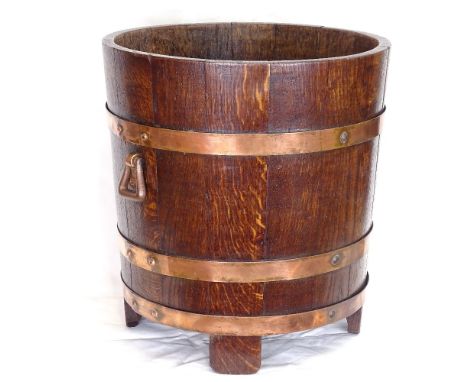 An Arts and Crafts RA Lister &amp; Co coopered oak jardiniere/planter, with swing handles, height 39cm 