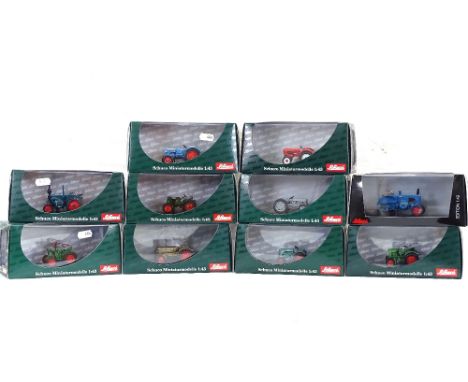 A quantity of Schuco miniature tractor models, all boxed, including Eicher Tiger, Lanz Traktor etc 