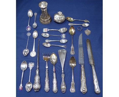 A collection of silver items, to include silver and enamel collector's spoons, silver-handled button hook, shoe horn, carving