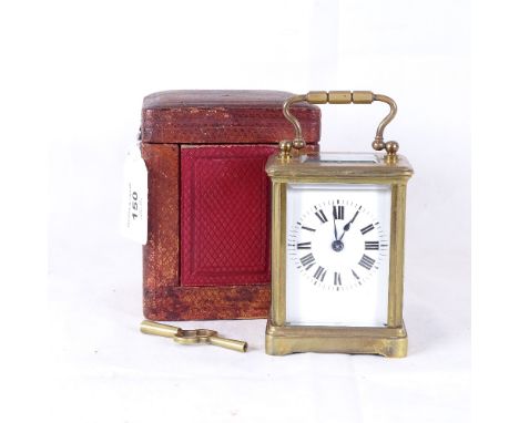A small brass-cased carriage clock, in original leather travelling case, with key, working order, height excluding handle 9cm