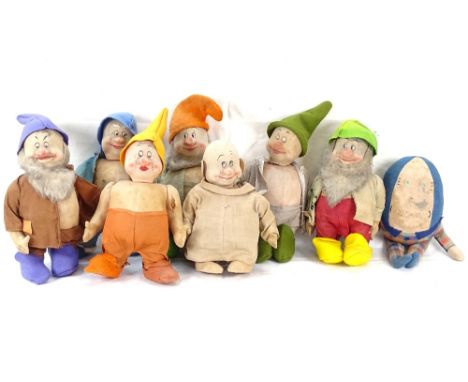 A group of Vintage straw-filled Snow White and the Seven Dwarfs dolls, and a Humpty Dumpty doll 