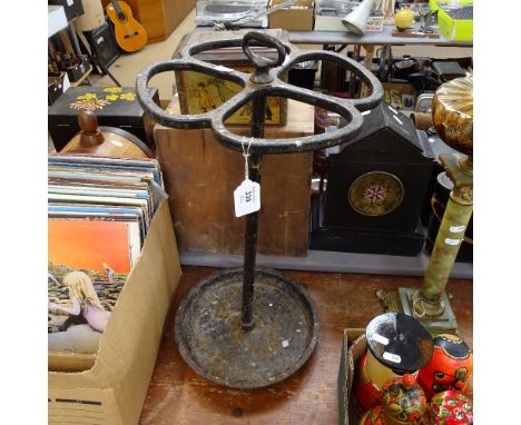 A black painted cast-iron 4-leaf clover design stick/umbrella stand, height 61cm 