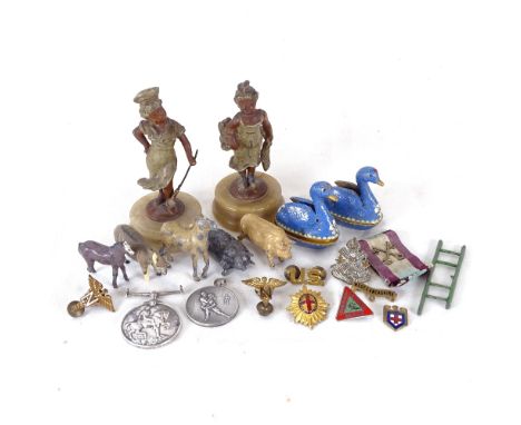 A pair of painted spelter figures on plinths, First War medal, pair of cloisonne enamel swans etc 