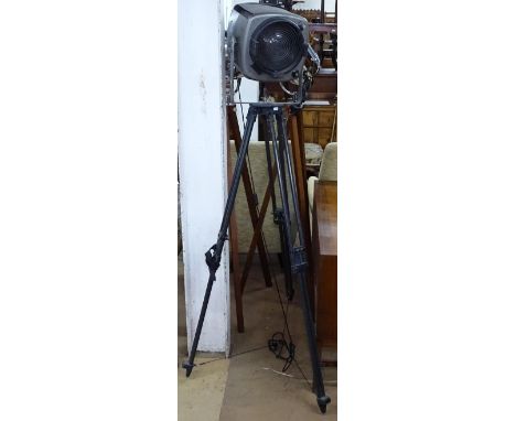 A Vintage stage spotlight on tripod stand, label for Strand Electric 