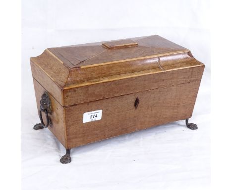 A Georgian rectangular mahogany tea caddy, lion mask handles with paw feet, length 32cm 