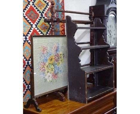 A stained pine open hanging shelf unit, W54cm, a Victorian mahogany towel rail, and a firescreen (3) 