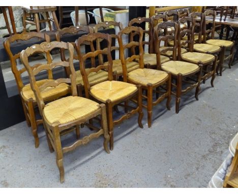 14 French oak ladder-back and rush-seated dining chairs 