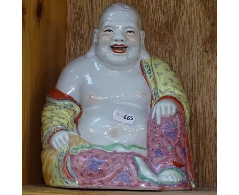 A Chinese painted ceramic Buddha, height 20.5cm 