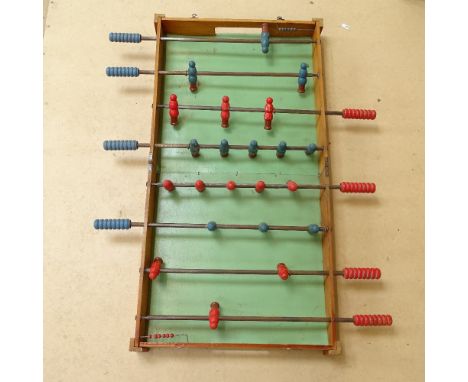 A Vintage folding table-top foosball game 