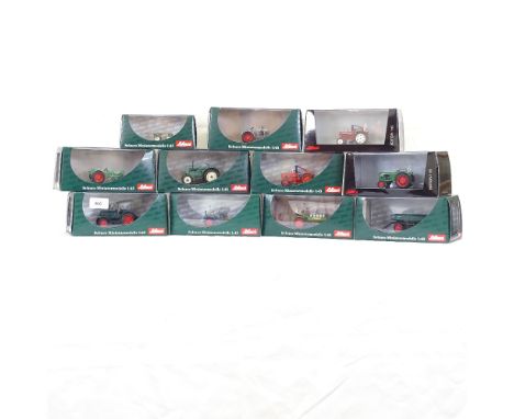 A quantity of various Schuco miniature farm tractor and accessory models, including Scheibenegge, Hanomag R40 etc, all boxed 