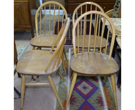 A set of 4 Ercol elm-seated stick-back kitchen chairs 