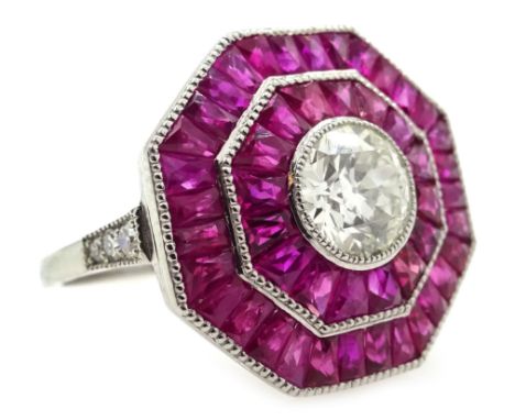 Old cut diamond and calibre cut ruby octagonal platinum (teste) target ring, with diamond set shoulders Condition Report Size