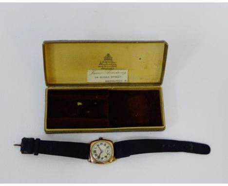 A gents vintage 9 carat gold cased wristwatch, the enamel dial with Arabic numerals and subsidiary seconds dial, on a leather