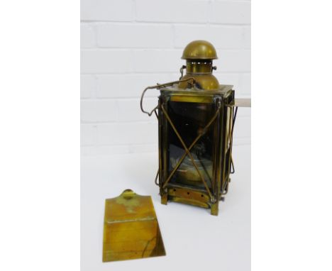 A French brass and glass panelled lantern lamp with makers mark 'St Ouen' model 1925, has a carry handle to top, height exclu