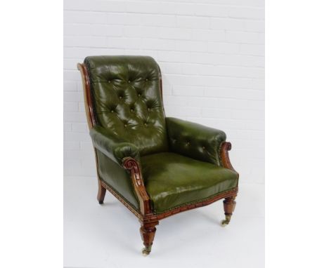 A walnut framed green leather button back armchair, 94 x 74cm 