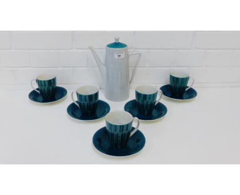 A retro Polish porcelain coffee pot by Walbrzych, together with a set of six Chodziez hand painted cups and five saucers, (12