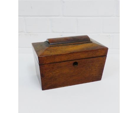 A rosewood sarcophagus shaped tea caddy, the hinged lid opening to reveal twin compartments