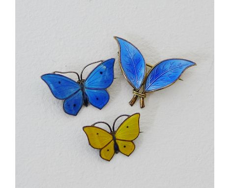 A Norwegian blue enamel and silver leaf brooch together with two enamel and silver butterfly brooches (3) 