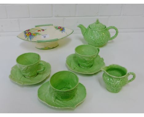 A Crown Devon's 'Morning Glory' patterned Art Deco bowl (restored), together with a Carlton ware green glazed and leaf moulde