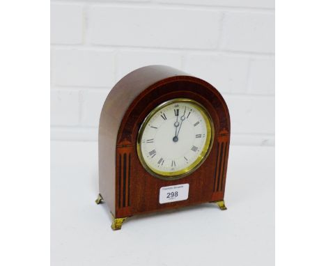 A mahogany and inlaid domed top mantle clock on brass feet, 18cm high