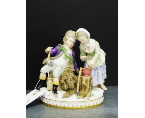 A 19th century Meissen boy and girl figure group, the boy modelled seated upon a sledge with an axe in his hand, wearing a fu