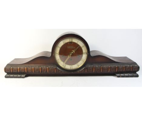 A 1950s walnut veneered mantle clock by Junghans, together with two oak cased Westminster chime mantle clocks. (3) 