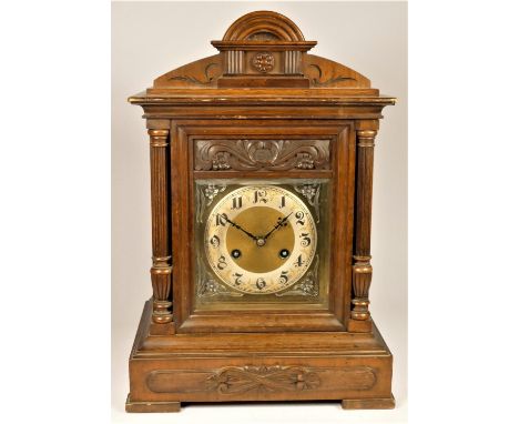 An Edwardian oak chiming and striking mantle clock, the gilt dial with silvered chapter ring, the movement by Junghans, strik