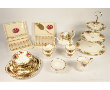 A collection of Royal Albert 'Country Roses' tea &amp; dinnerware, twenty one pieces to include - 4 teacups, 4 saucers, 4 sid