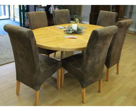 A light oak circular extending dining table with central removable leaf on a painted pedestal base, 180 x 124 cm (extended) t