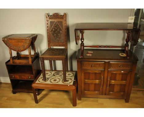 A teak tile inlaid coffee table, a carved oak hall chair, a carved oak drop leaf table, a small oak dresser base, a mahogany 