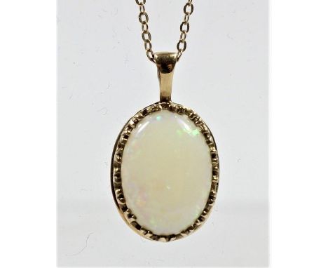 A 9ct gold mounted opal pendant, chain, stone 14 x 10mm, 2.8gm 