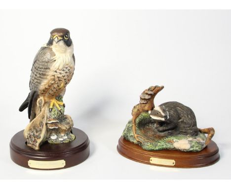 A Royal Doulton model of a badger 'The Wildlife Collection' DA8, on wood plinth, together with a model of a Peregrine Falcon 